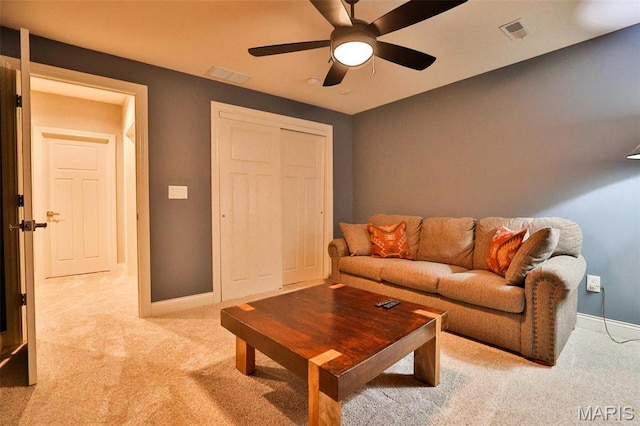1120 Franklin Ave, Edwardsville, IL 62025 - carpeted living area with baseboards and a ceiling fan