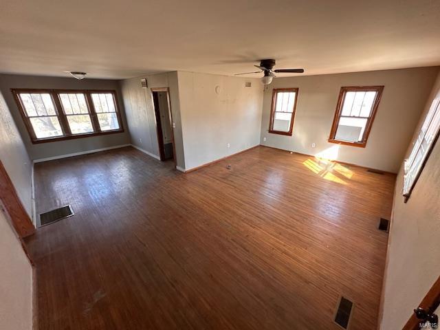 415 N Grand St, Willow Springs, MO 65793 - empty room with ceiling fan, dark wood-style floors, and baseboards