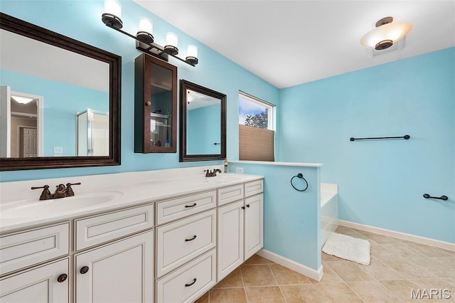 615 Derby Way Dr, Wentzville, MO 63385 - bathroom featuring double vanity, a garden tub, and tile patterned floors