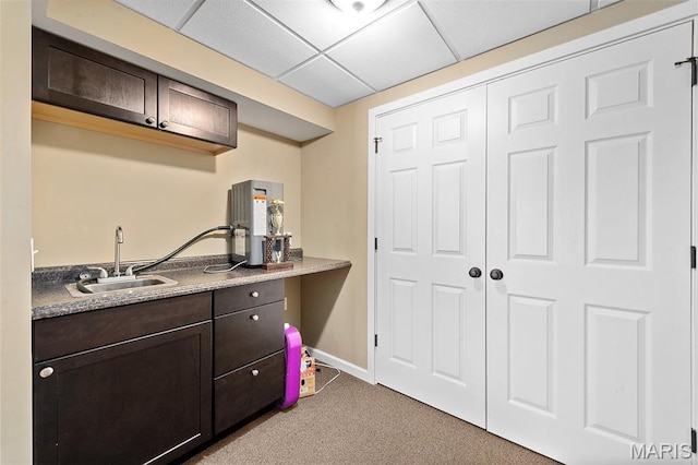 615 Derby Way Dr, Wentzville, MO 63385 - kitchen featuring carpet floors, dark brown cabinetry, and a paneled ceiling