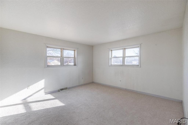 2125 Barron Rd, Poplar Bluff, MO 63901 - carpeted spare room featuring plenty of natural light and a textured ceiling