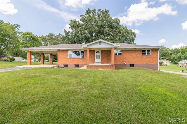 2125 Barron Rd, Poplar Bluff, MO 63901 - single story home with concrete driveway, a carport, a front yard, and brick siding