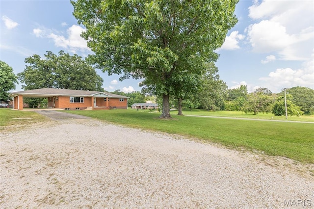 2125 Barron Rd, Poplar Bluff, MO 63901 - ranch-style home featuring an attached carport, driveway, and a front yard