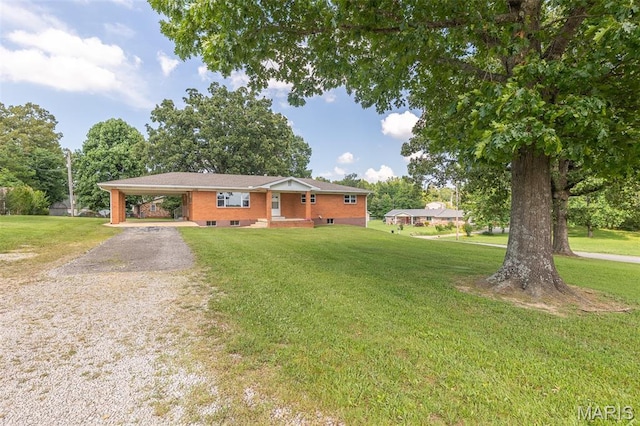 2125 Barron Rd, Poplar Bluff, MO 63901 - ranch-style home with a front yard, a carport, and gravel driveway