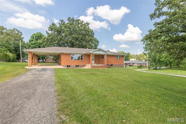 2125 Barron Rd, Poplar Bluff, MO 63901 - ranch-style house with a carport, driveway, a front yard, and brick siding