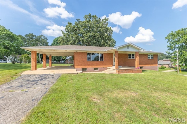 2125 Barron Rd, Poplar Bluff, MO 63901 - ranch-style home with driveway, an attached carport, a front lawn, and brick siding