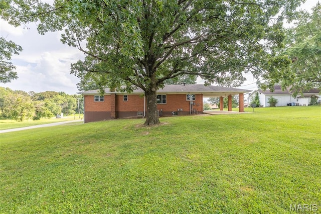 2125 Barron Rd, Poplar Bluff, MO 63901 - view of property exterior featuring a yard and brick siding
