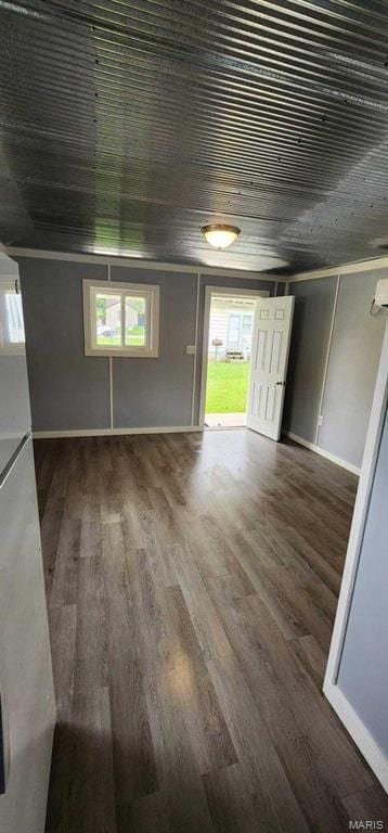 305 E Main St, Willow Springs, MO 65793 - unfurnished living room with healthy amount of natural light, wood finished floors, and wooden ceiling