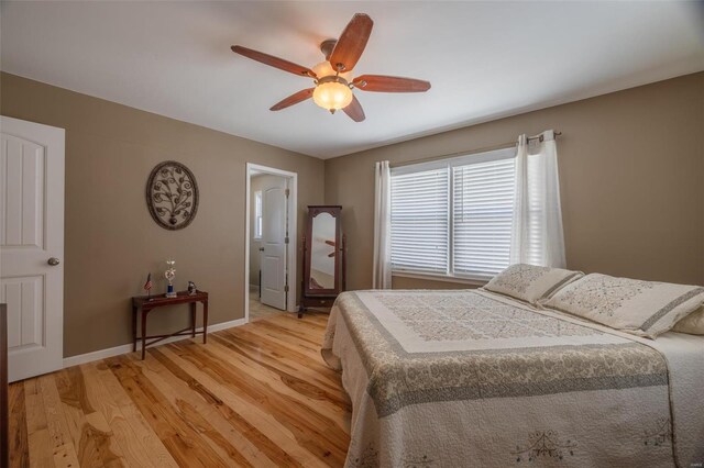 bedroom featuring light wood-style flooring, baseboards, and ceiling fan