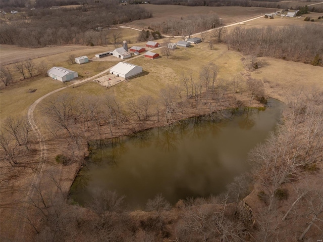 aerial view of property's location with rural landscape and a nearby body of water