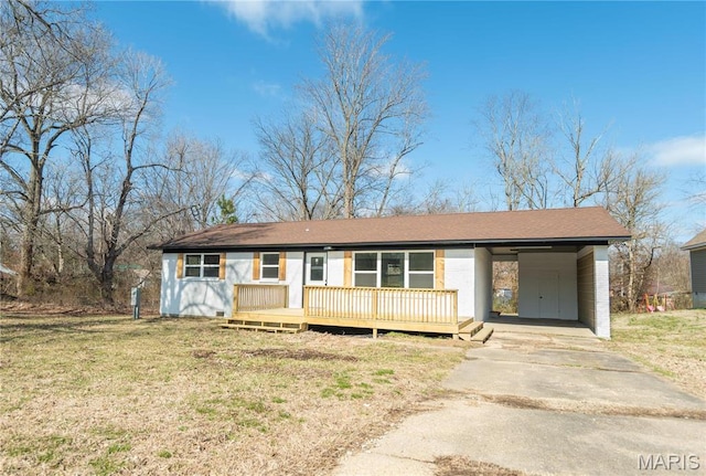 514 W Missouri St, Bloomfield, MO 63825 - ranch-style house with driveway, a front yard, an attached carport, and a wooden deck