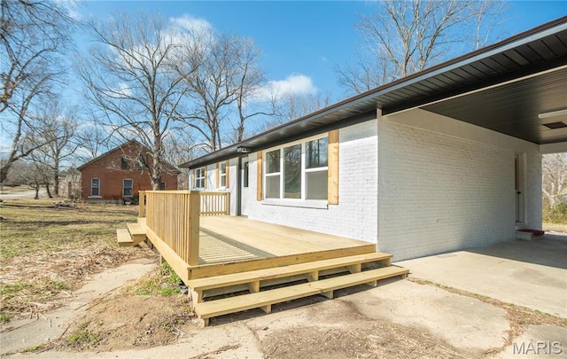 514 W Missouri St, Bloomfield, MO 63825 - view of property exterior with brick siding and a deck