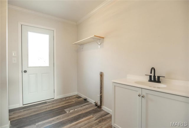 514 W Missouri St, Bloomfield, MO 63825 - clothes washing area with a sink, crown molding, dark wood finished floors, and baseboards