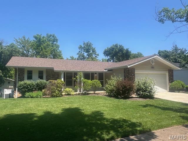 1211 Dorne Dr, Manchester, MO 63021 - single story home with an attached garage, a front lawn, and concrete driveway