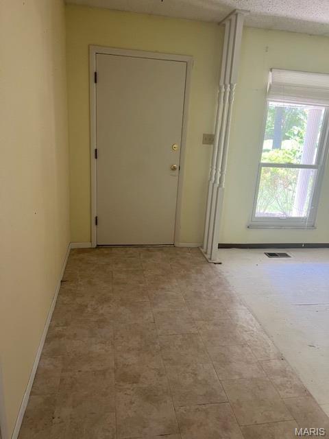 1211 Dorne Dr, Manchester, MO 63021 - entryway featuring baseboards
