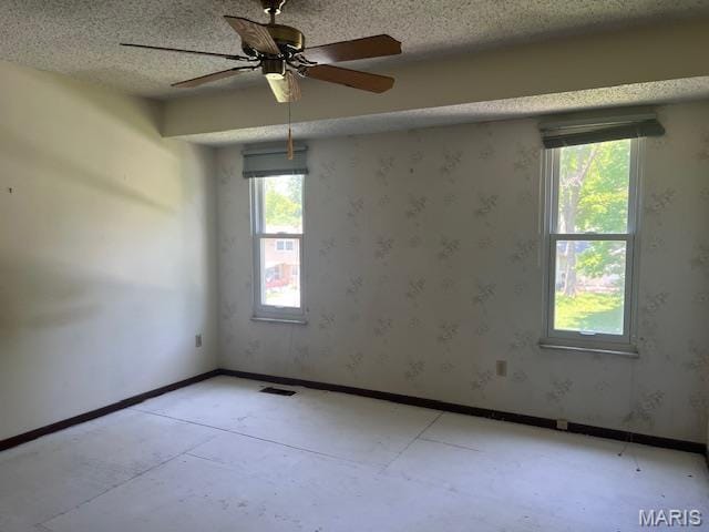 1211 Dorne Dr, Manchester, MO 63021 - empty room featuring ceiling fan and a textured ceiling