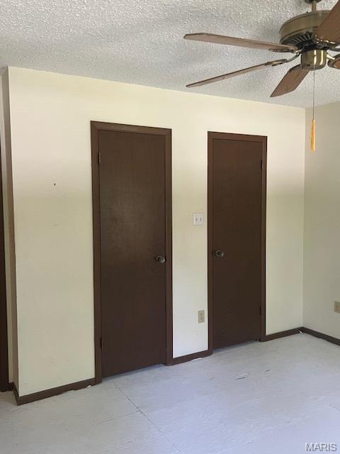 1211 Dorne Dr, Manchester, MO 63021 - unfurnished room featuring a textured ceiling and a ceiling fan