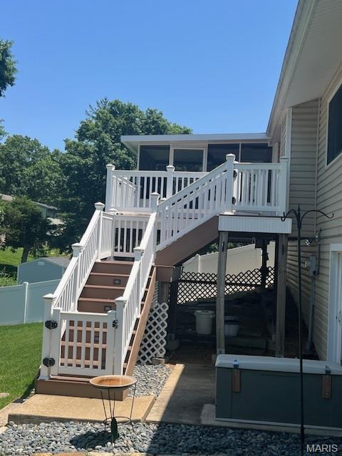1211 Dorne Dr, Manchester, MO 63021 - back of property featuring stairs, a sunroom, and a wooden deck