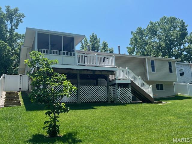 1211 Dorne Dr, Manchester, MO 63021 - back of house featuring stairs, a deck, and a sunroom