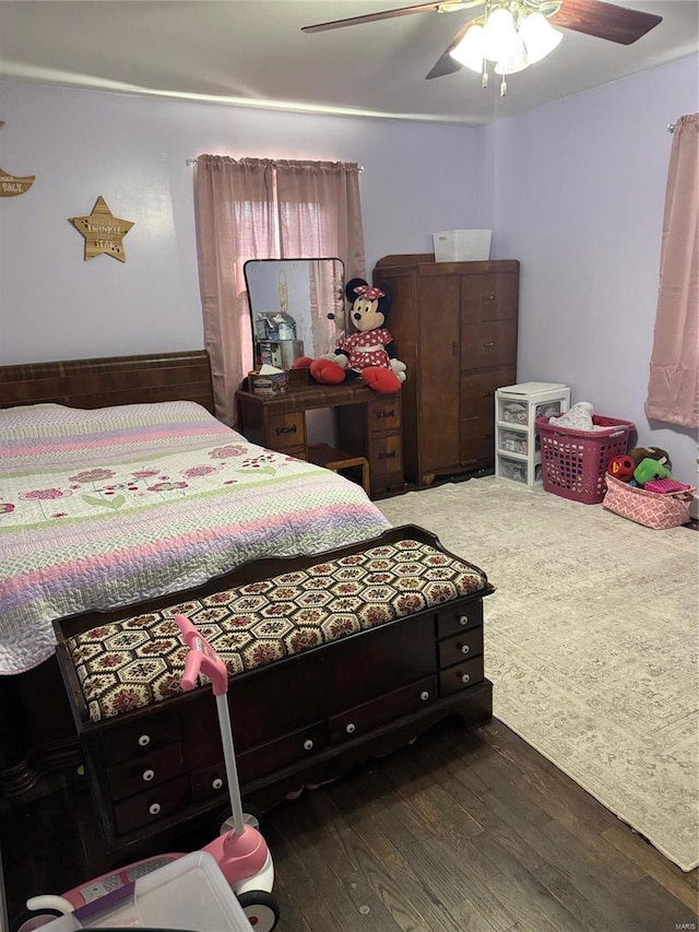 bedroom featuring wood finished floors and ceiling fan