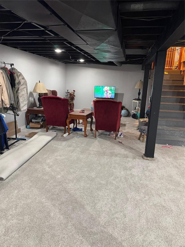 finished below grade area featuring carpet floors and stairs