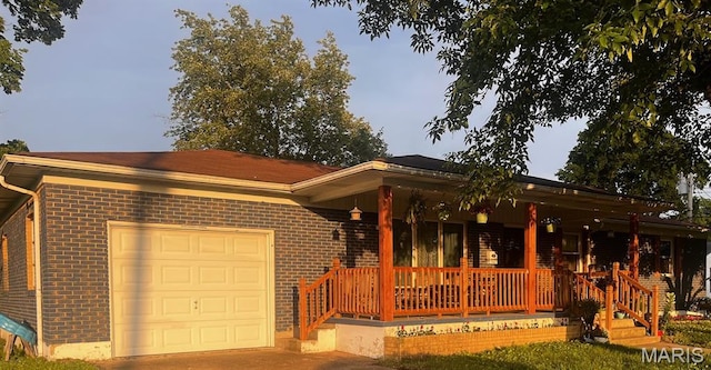 522 N Elm, Dexter, MO 63841 - single story home with brick siding, covered porch, and an attached garage