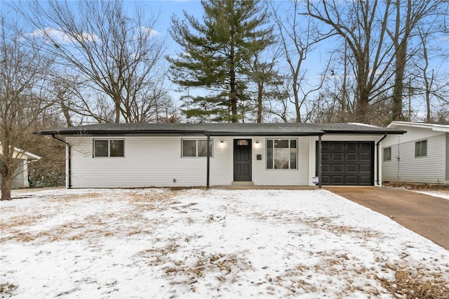 1686 Mowbry Ln, Saint Louis, MO 63136 - view of front facade featuring a garage and driveway