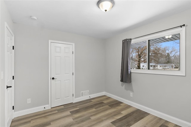 1686 Mowbry Ln, Saint Louis, MO 63136 - spare room with baseboards, wood finished floors, and a smoke detector