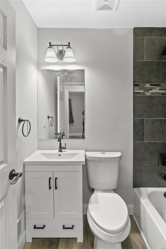 1686 Mowbry Ln, Saint Louis, MO 63136 - bathroom featuring wood finished floors, vanity, toilet, and baseboards