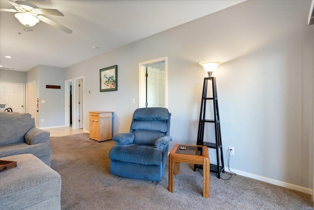 living room with light colored carpet, ceiling fan, baseboards, and recessed lighting