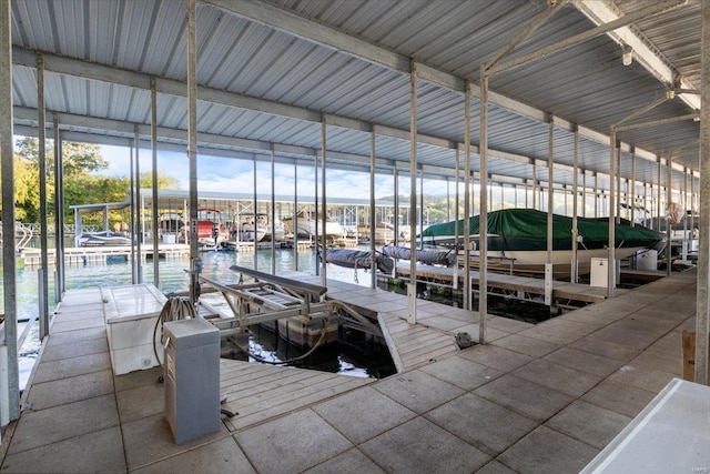 dock featuring boat lift and a water view