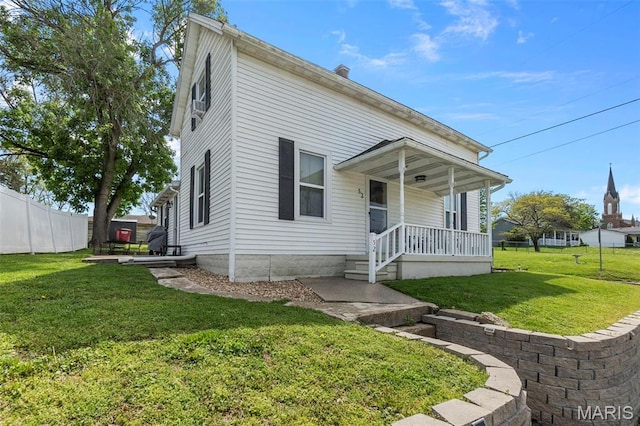 view of front of home featuring a porch and a chimney