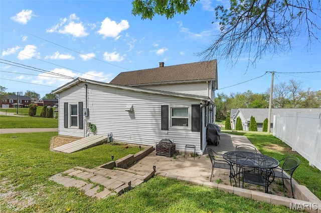 rear view of house featuring a patio