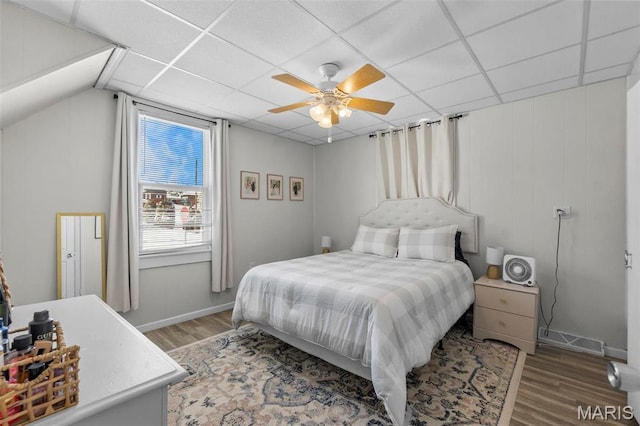 bedroom featuring wood finished floors and a ceiling fan