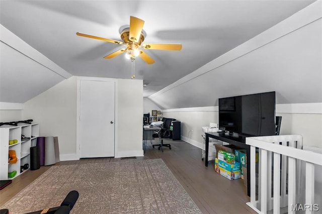 office area with ceiling fan, wood finished floors, vaulted ceiling, and baseboards