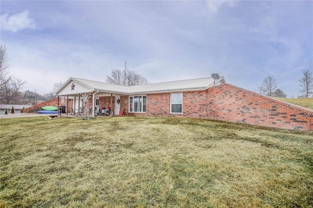 302 E Bay St, Pleasant Hill, IL 62366 - rear view of house with covered porch, a yard, metal roof, and brick siding