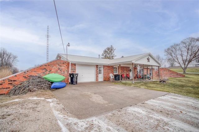 302 E Bay St, Pleasant Hill, IL 62366 - view of property exterior with an attached garage, driveway, brick siding, covered porch, and a yard