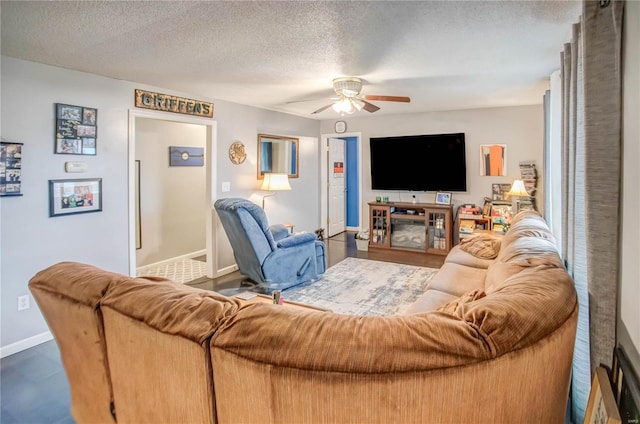302 E Bay St, Pleasant Hill, IL 62366 - living area featuring ceiling fan, baseboards, and a textured ceiling