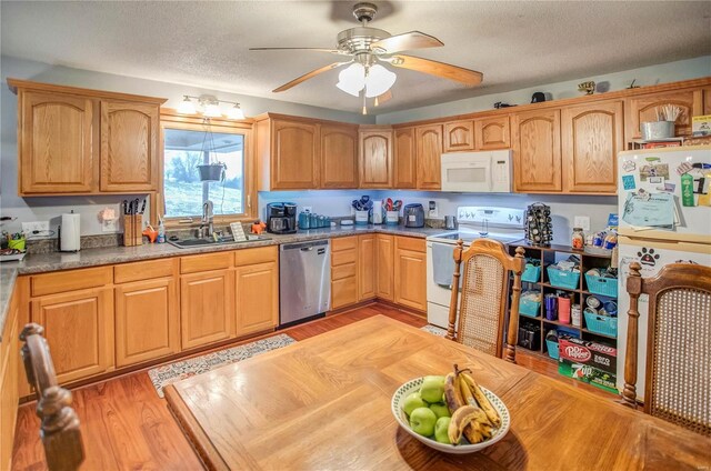 302 E Bay St, Pleasant Hill, IL 62366 - kitchen featuring white appliances, a sink, light wood-type flooring, ceiling fan, and a textured ceiling