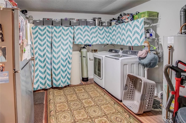 302 E Bay St, Pleasant Hill, IL 62366 - clothes washing area with washer and dryer, a textured ceiling, and gas water heater
