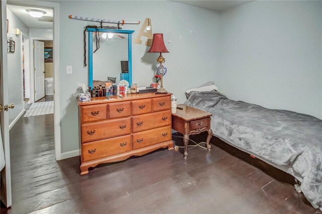 302 E Bay St, Pleasant Hill, IL 62366 - bedroom featuring dark wood finished floors and baseboards