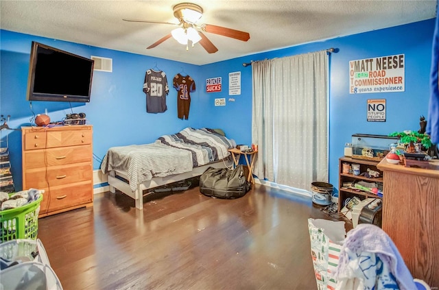 302 E Bay St, Pleasant Hill, IL 62366 - bedroom featuring wood finished floors, a textured ceiling, and a ceiling fan