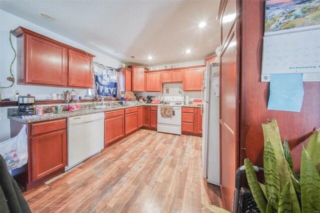 31950 County Road 6250, Edgar Springs, MO 65462 - kitchen with white appliances, light wood finished floors, recessed lighting, light countertops, and a sink