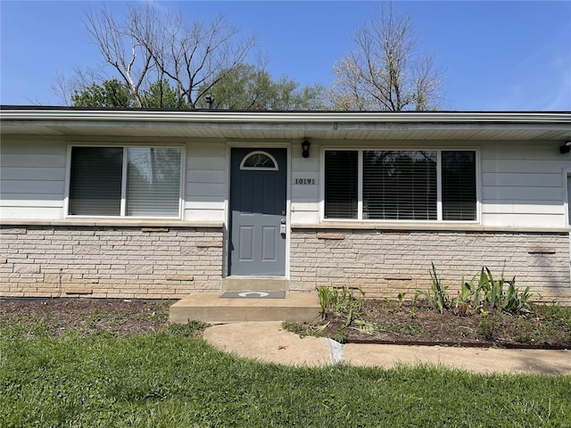10191 Mayfair Dr, Saint Louis, MO 63136 - doorway to property with brick siding