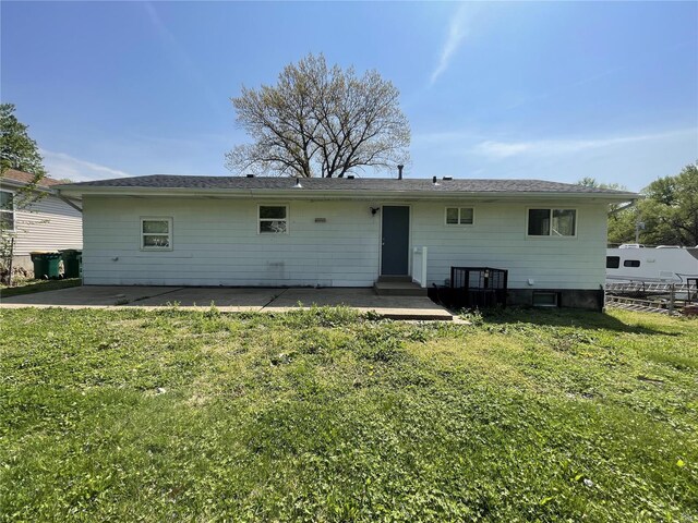 10191 Mayfair Dr, Saint Louis, MO 63136 - back of property featuring a patio area and a lawn