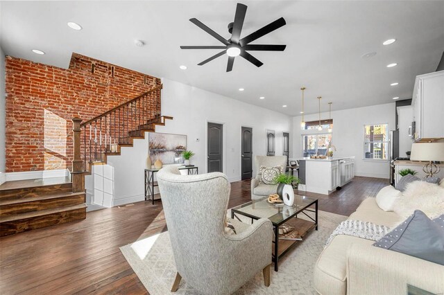 3330 Iowa Ave, Saint Louis, MO 63118 - living room featuring stairs, wood finished floors, recessed lighting, a ceiling fan, and baseboards
