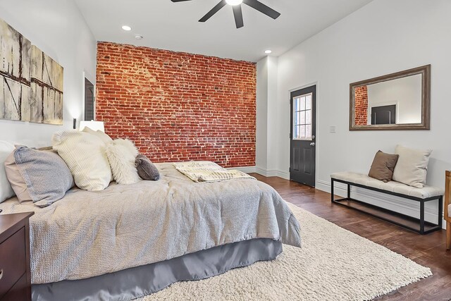 3330 Iowa Ave, Saint Louis, MO 63118 - bedroom with brick wall, wood finished floors, a ceiling fan, recessed lighting, and baseboards