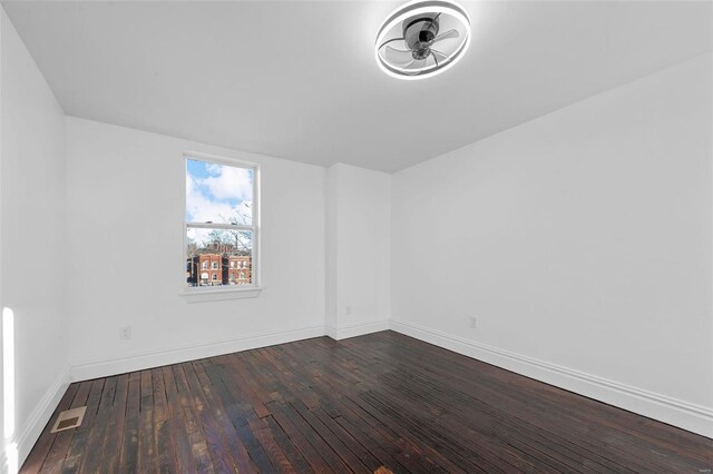 3330 Iowa Ave, Saint Louis, MO 63118 - spare room featuring wood finished floors and baseboards