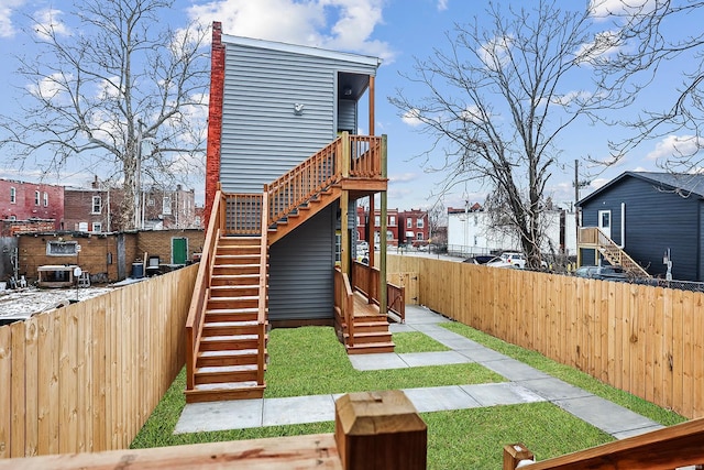 3330 Iowa Ave, Saint Louis, MO 63118 - rear view of property with stairs, a fenced backyard, and a residential view
