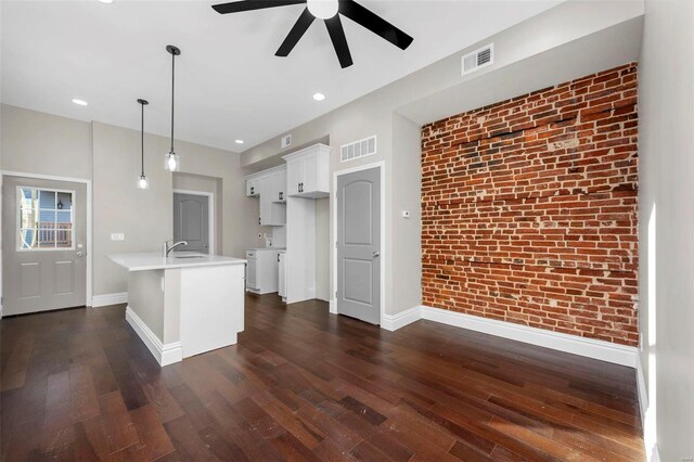 3330 Iowa Ave, Saint Louis, MO 63118 - kitchen with baseboards, ceiling fan, dark wood-style floors, brick wall, and recessed lighting
